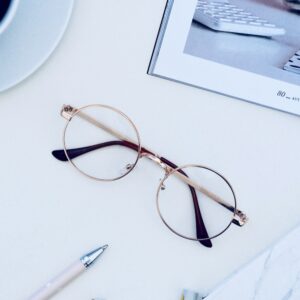 A pair of glasses on a white table