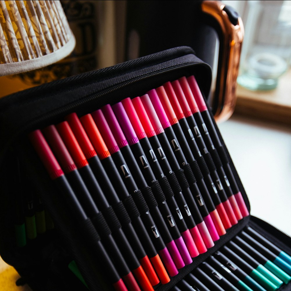 A case of colourful markers arranged neatly
