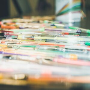 Assorted-colour pens on a table