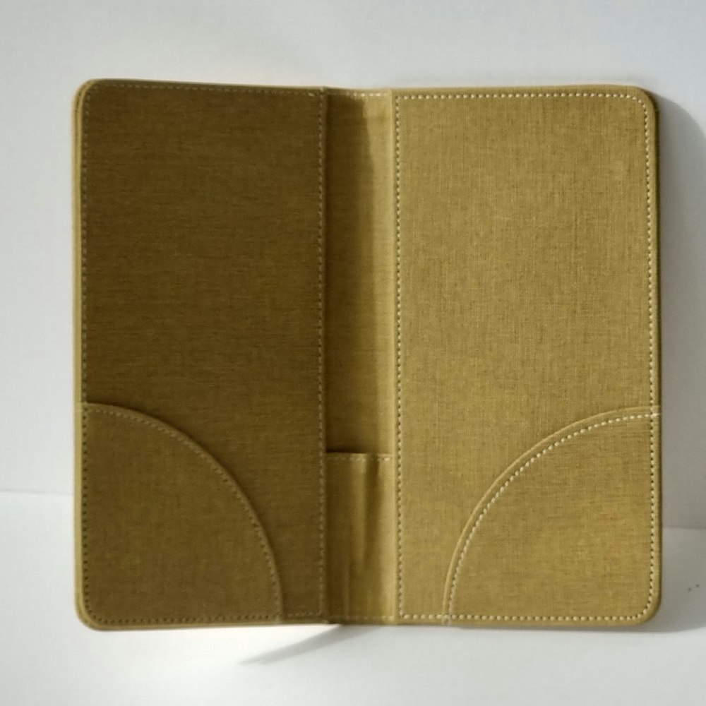 An open tan folder standing on a white background