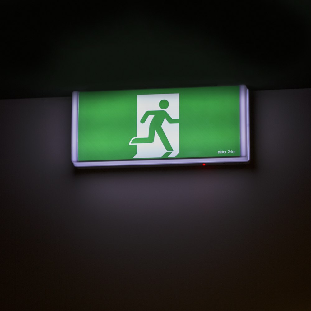 A green fire exit sign