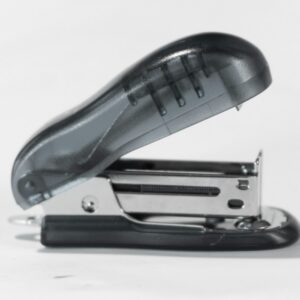 Blue and silver stapler on a white table