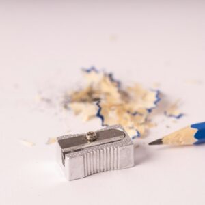 Blue pencil sharpener on a white surface