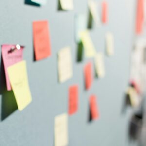 Colourful sticky notes pinned to a board