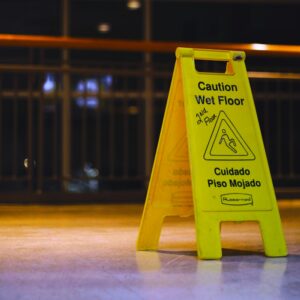 Yellow wet floor caution sign indoors