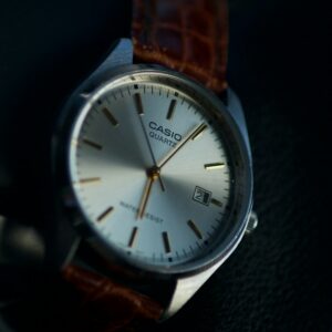 Silver and white analogue wristwatch